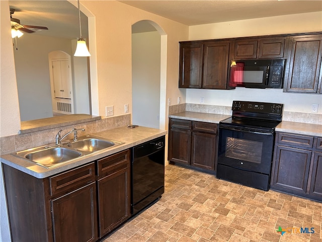 kitchen featuring black appliances, dark brown cabinetry, hanging light fixtures, sink, and ceiling fan