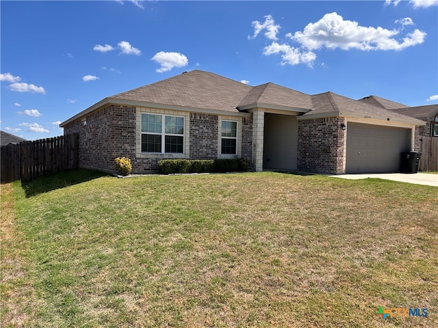 single story home featuring a garage and a front yard