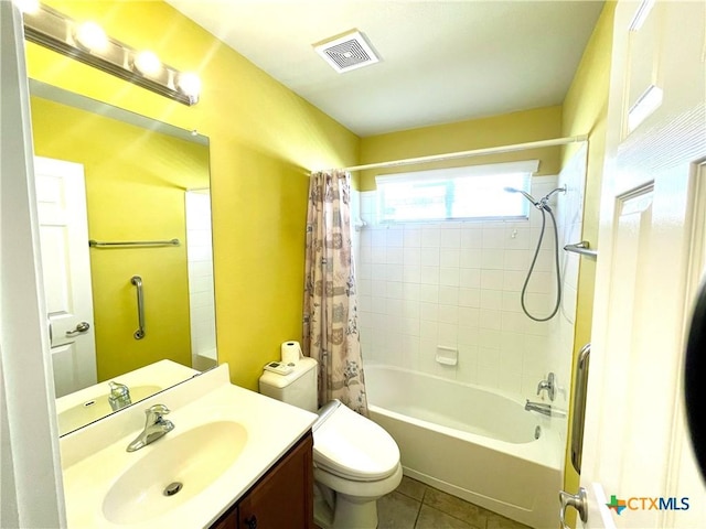 bathroom with visible vents, toilet, shower / tub combo, vanity, and tile patterned floors