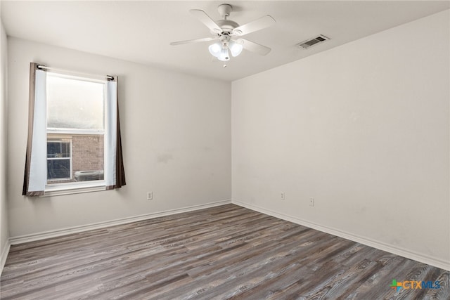 unfurnished room with ceiling fan and hardwood / wood-style floors