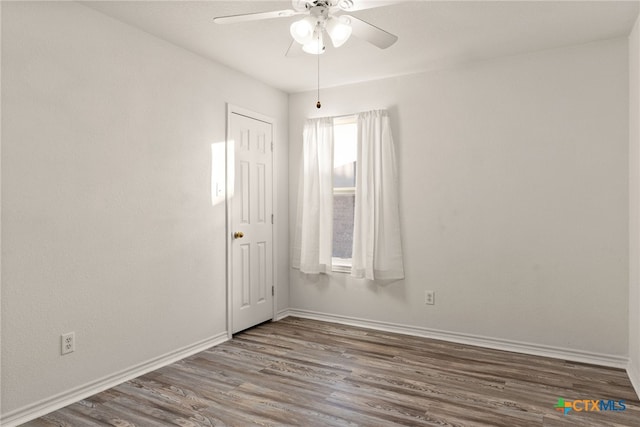 spare room featuring ceiling fan and hardwood / wood-style flooring