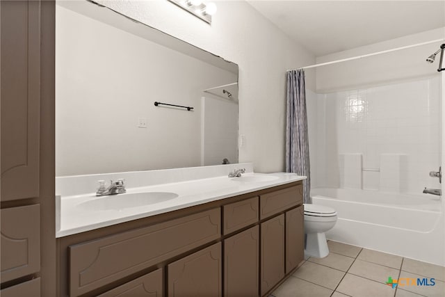 full bathroom featuring tile patterned floors, vanity, toilet, and shower / bathtub combination with curtain