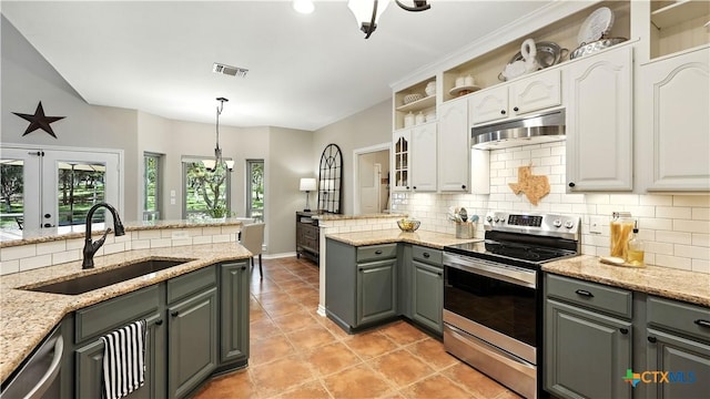 405 Pinnacle Pkwy, New Braunfels, TX 78132 - kitchen featuring appliances with stainless steel finishes, under cabinet range hood, gray cabinetry, tasteful backsplash, and white cabinetry