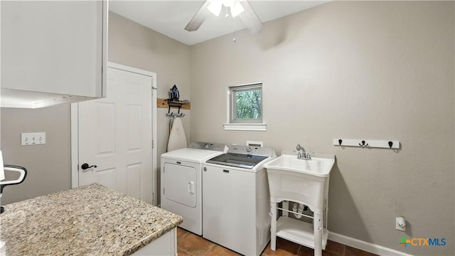 405 Pinnacle Pkwy, New Braunfels, TX 78132 - laundry area with washing machine and clothes dryer, a ceiling fan, light tile patterned floors, and cabinet space