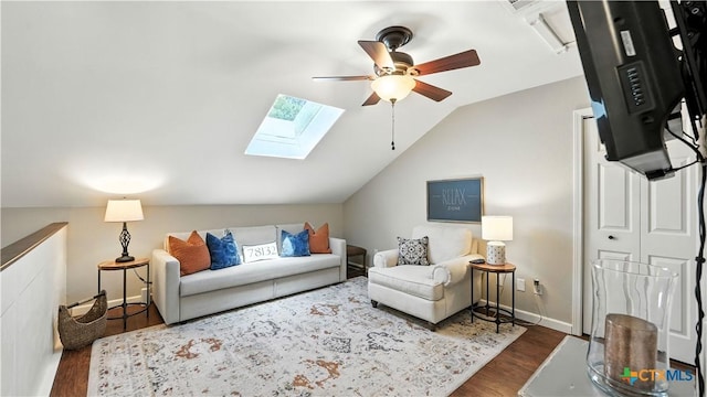 405 Pinnacle Pkwy, New Braunfels, TX 78132 - living area featuring wood finished floors, ceiling fan, vaulted ceiling, and a skylight