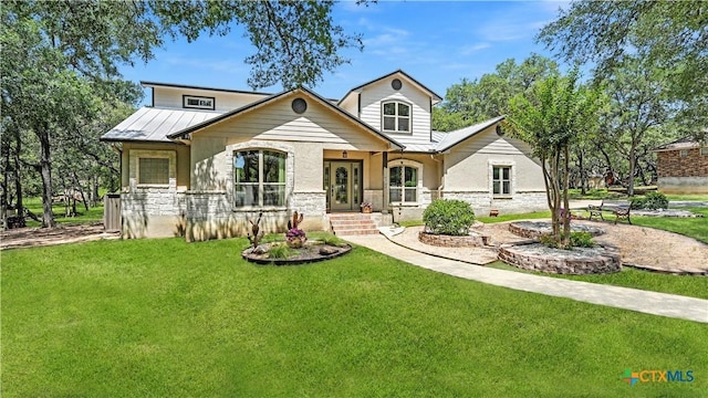405 Pinnacle Pkwy, New Braunfels, TX 78132 - view of front facade with a front yard, a standing seam roof, stone siding, and a metal roof