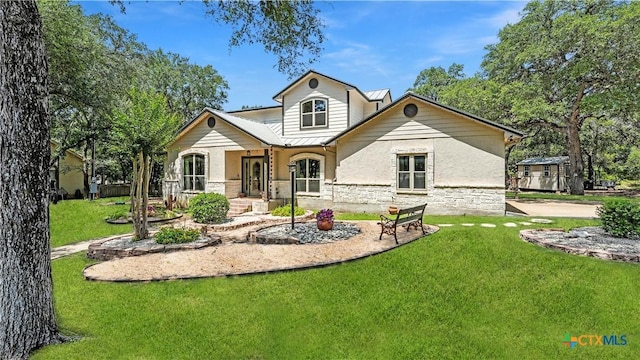 405 Pinnacle Pkwy, New Braunfels, TX 78132 - rear view of house featuring stone siding, a lawn, and stucco siding