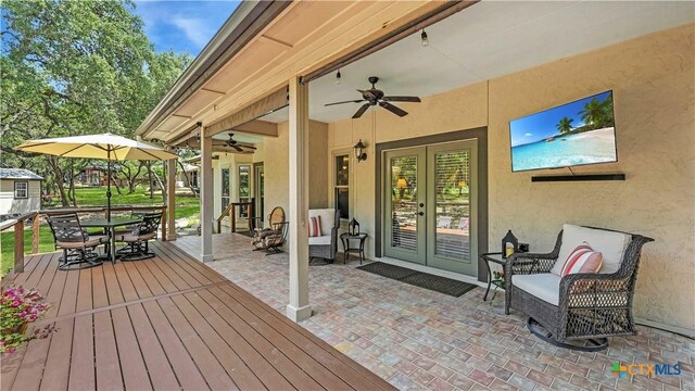 405 Pinnacle Pkwy, New Braunfels, TX 78132 - deck with french doors, ceiling fan, outdoor dining area, and a patio