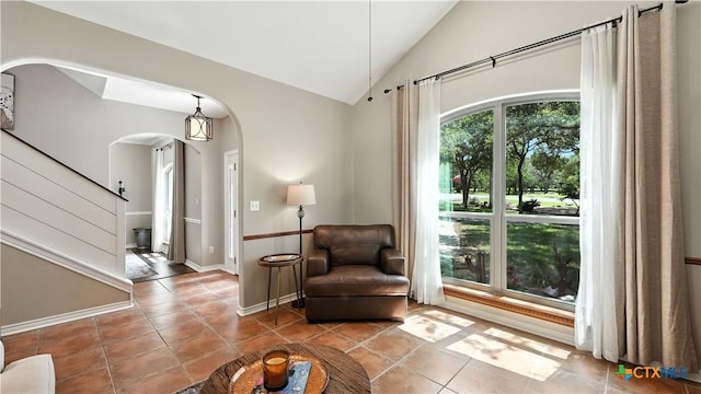 405 Pinnacle Pkwy, New Braunfels, TX 78132 - living area with arched walkways, tile patterned flooring, and lofted ceiling