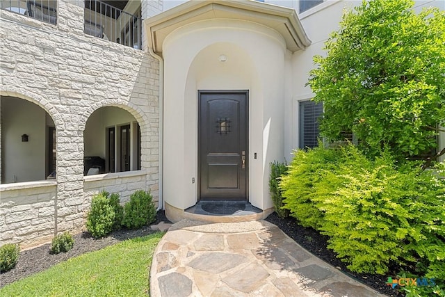 124 Schooner Dr, Lakeway, TX 78738 - property entrance with stone siding and stucco siding