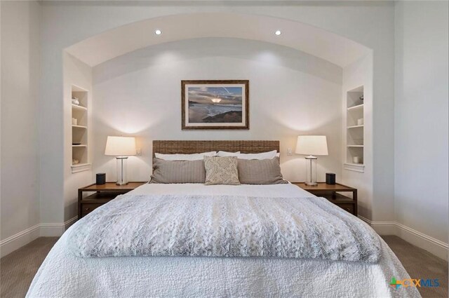 124 Schooner Dr, Lakeway, TX 78738 - carpeted bedroom with recessed lighting and arched walkways