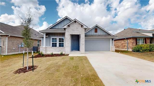 craftsman house featuring central air condition unit, a front yard, and a garage