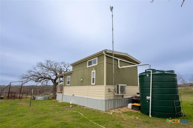 3270 Fm 671, Luling, TX 78648 - view of side of property featuring ac unit, fence, and a lawn