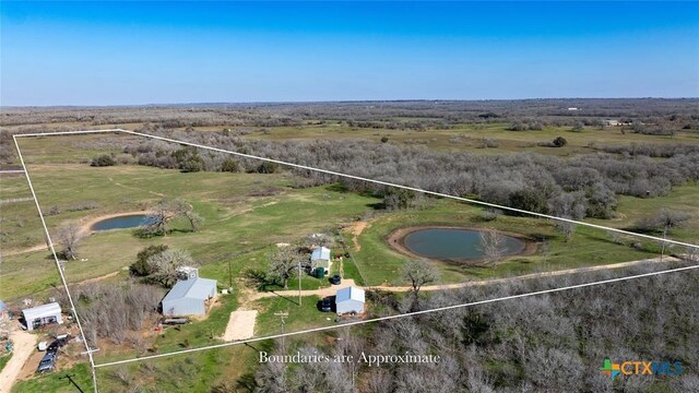 3270 Fm 671, Luling, TX 78648 - aerial view of sparsely populated area featuring property parcel outlined and a nearby body of water