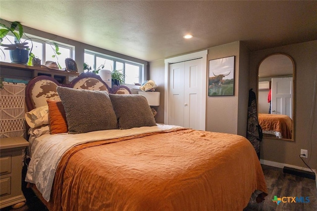 3270 Fm 671, Luling, TX 78648 - bedroom with baseboards, recessed lighting, arched walkways, and dark wood finished floors