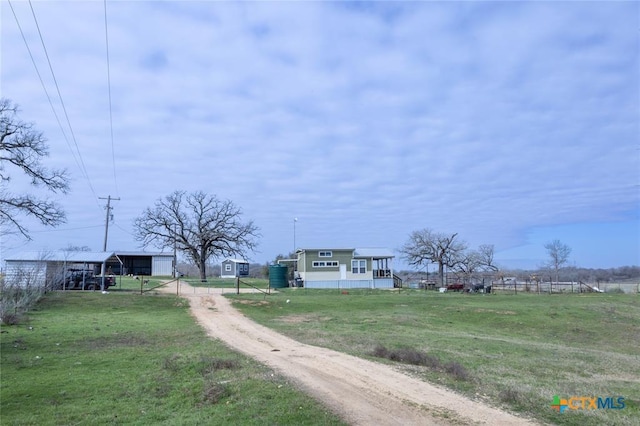 3270 Fm 671, Luling, TX 78648 - view of street featuring an outbuilding and dirt driveway
