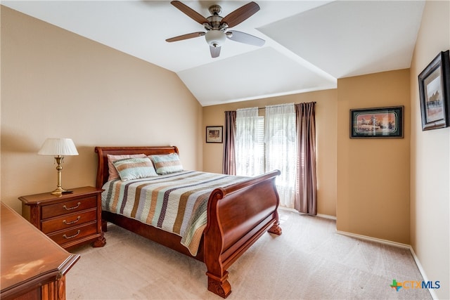 carpeted bedroom with lofted ceiling and ceiling fan