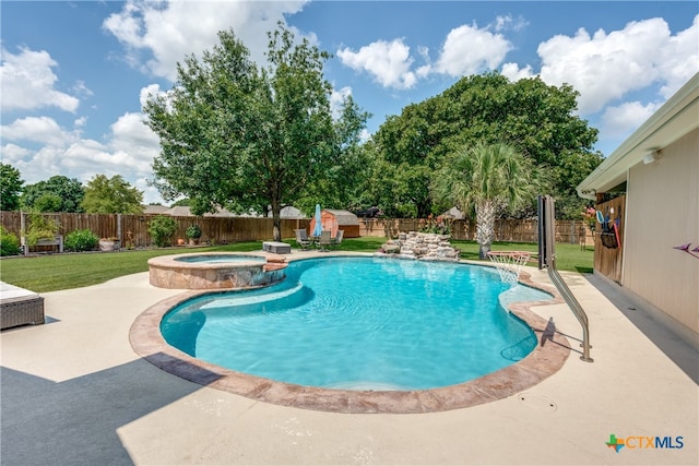 view of pool with an in ground hot tub, pool water feature, and a patio area