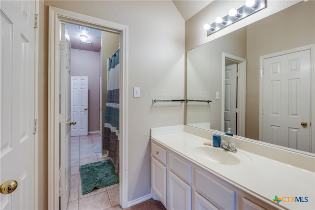 bathroom with vanity, a shower with shower curtain, and tile patterned flooring