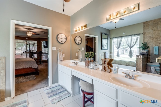 bathroom with tile patterned flooring and vanity