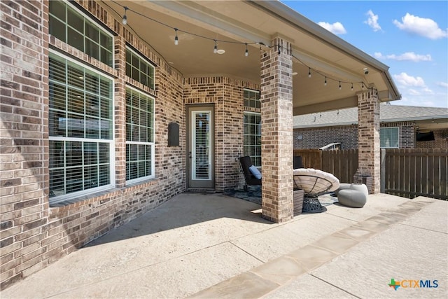 view of patio featuring fence