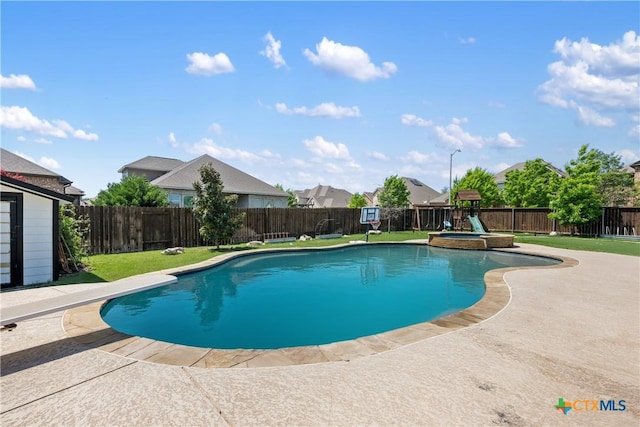 view of pool with a patio, a pool with connected hot tub, a yard, a fenced backyard, and a playground