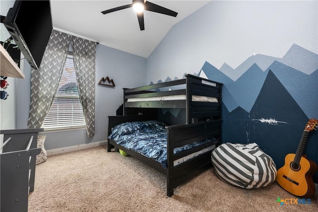 carpeted bedroom with baseboards, ceiling fan, and lofted ceiling