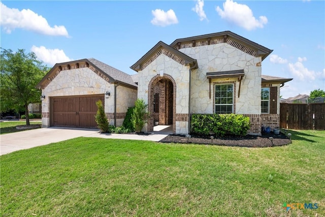 view of front facade featuring concrete driveway, fence, stone siding, and a garage