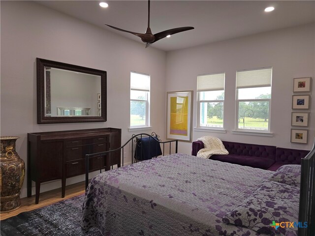 bedroom with ceiling fan, wood finished floors, and recessed lighting