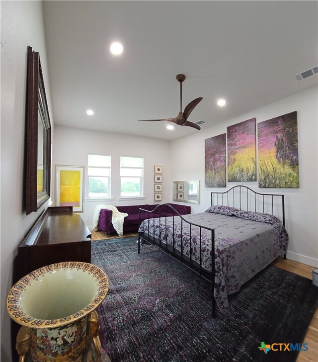 bedroom with ceiling fan, recessed lighting, wood finished floors, visible vents, and baseboards