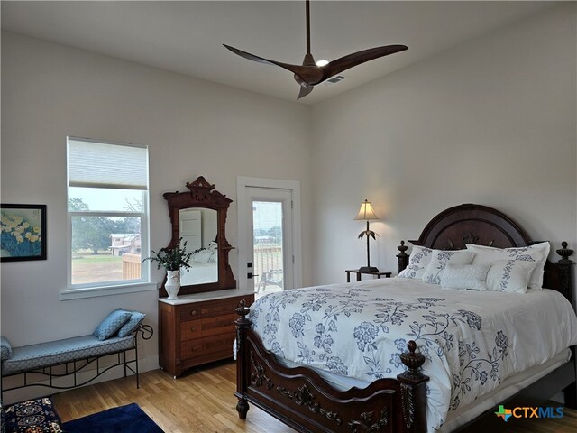 bedroom featuring light wood-style flooring and ceiling fan