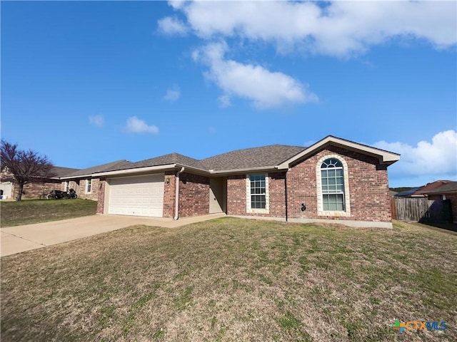 ranch-style home featuring driveway, a front lawn, fence, a garage, and brick siding