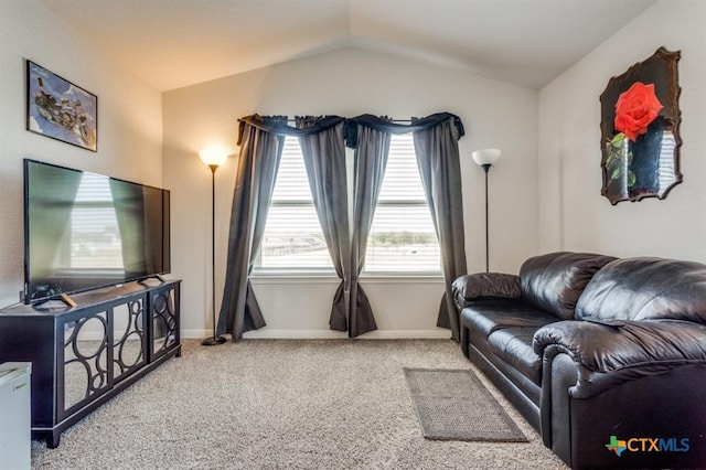 living room with carpet flooring and vaulted ceiling