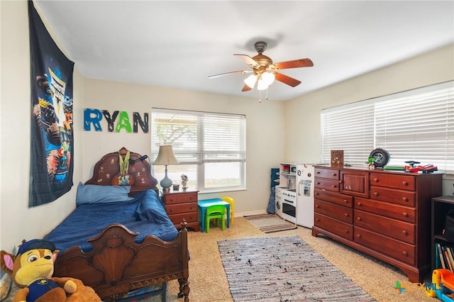 carpeted bedroom with ceiling fan