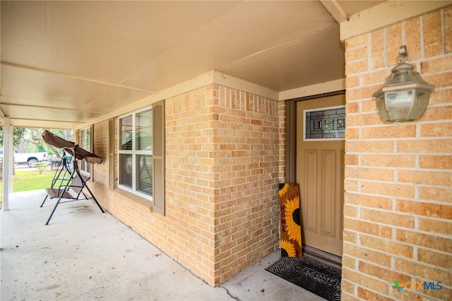 property entrance with covered porch