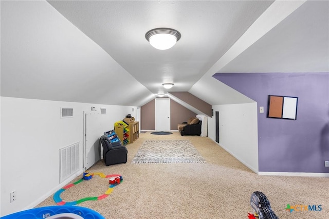 game room with carpet and lofted ceiling