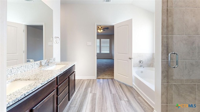 4024 Hayes Ct, Belton, TX 76513 - full bathroom with a bath, wood finished floors, double vanity, ceiling fan, and a shower stall