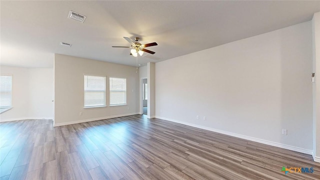 4024 Hayes Ct, Belton, TX 76513 - spare room with a ceiling fan, wood finished floors, and baseboards
