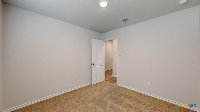 4024 Hayes Ct, Belton, TX 76513 - unfurnished room featuring light colored carpet, baseboards, and a smoke detector