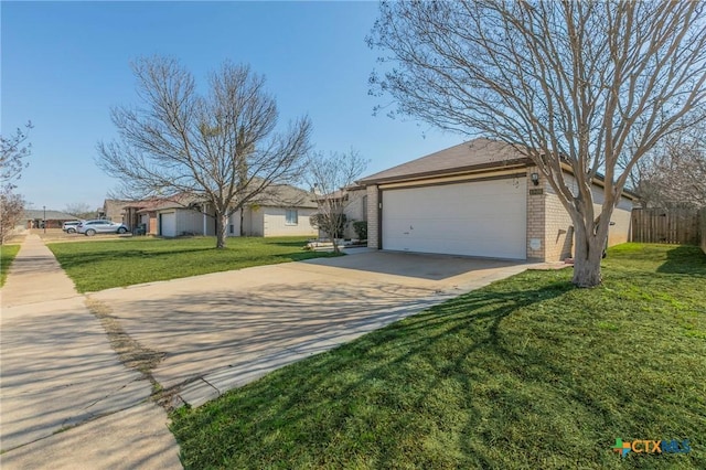 view of property exterior with brick siding, concrete driveway, a lawn, an attached garage, and fence