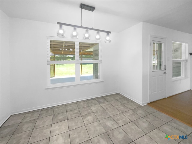 unfurnished dining area with light wood-type flooring