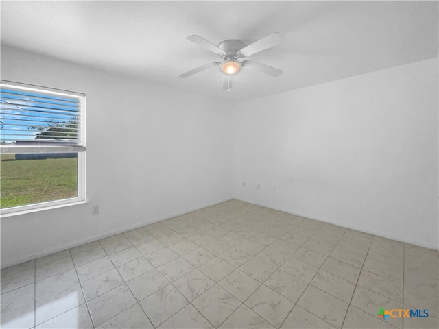 unfurnished room with ceiling fan