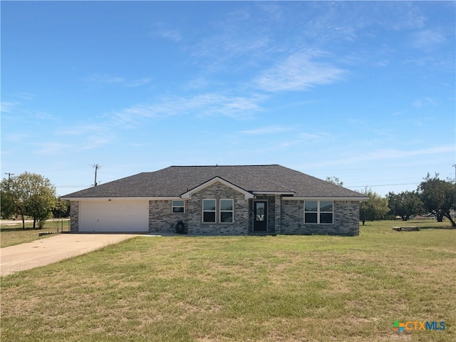 single story home featuring a front lawn and a garage