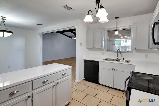 kitchen featuring pendant lighting, sink, black dishwasher, and stove