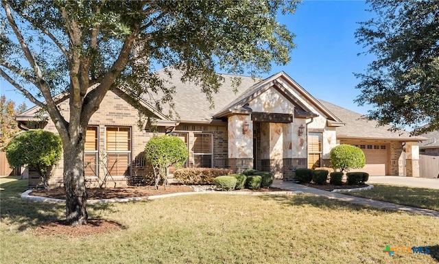 craftsman inspired home featuring a front yard and a garage