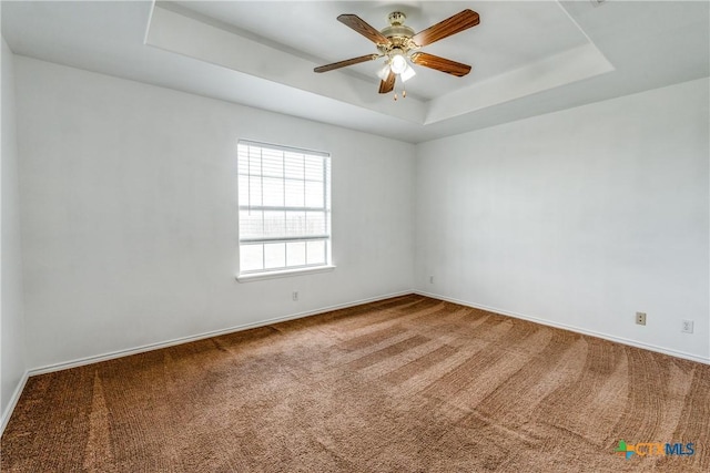 628 Cordova Loop, Seguin, TX 78155 - unfurnished room with a raised ceiling, carpet floors, ceiling fan, and baseboards