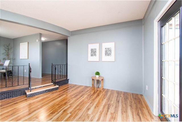 spare room with wood finished floors