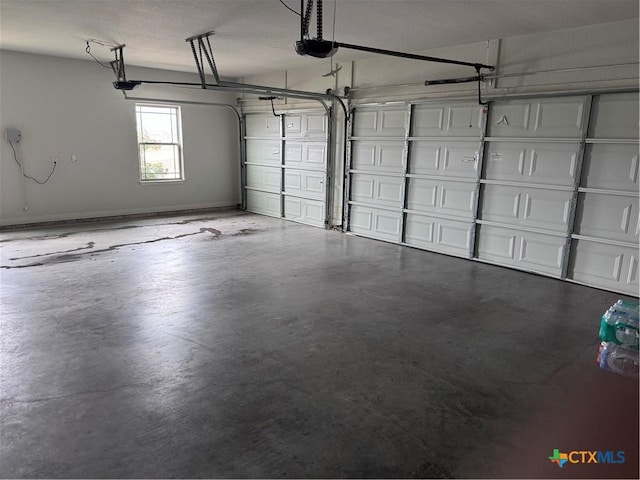 3220 Wild Seed Dr, Salado, TX 76571 - garage featuring a garage door opener and baseboards