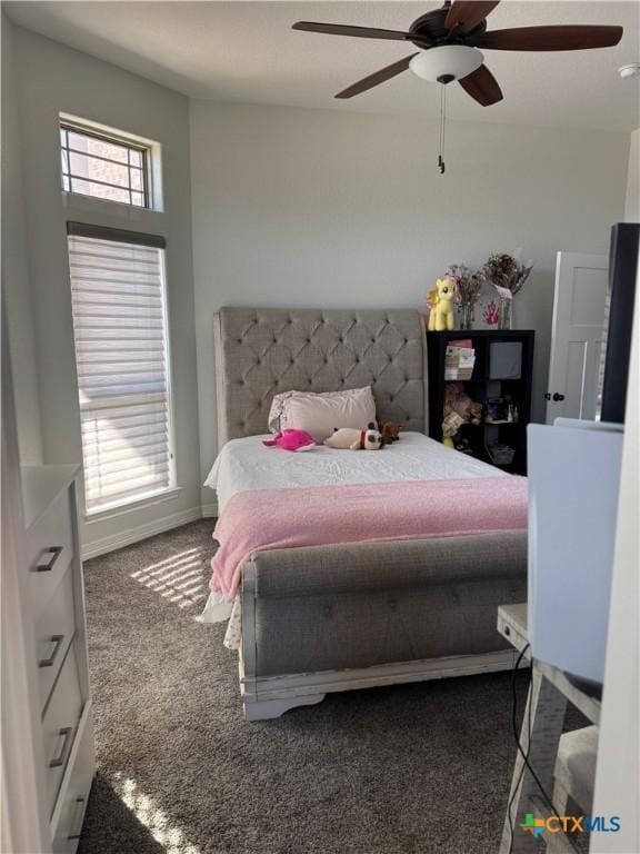 3220 Wild Seed Dr, Salado, TX 76571 - carpeted bedroom with baseboards and ceiling fan