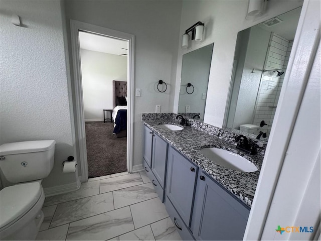 3220 Wild Seed Dr, Salado, TX 76571 - ensuite bathroom featuring marble finish floor, a sink, toilet, and double vanity